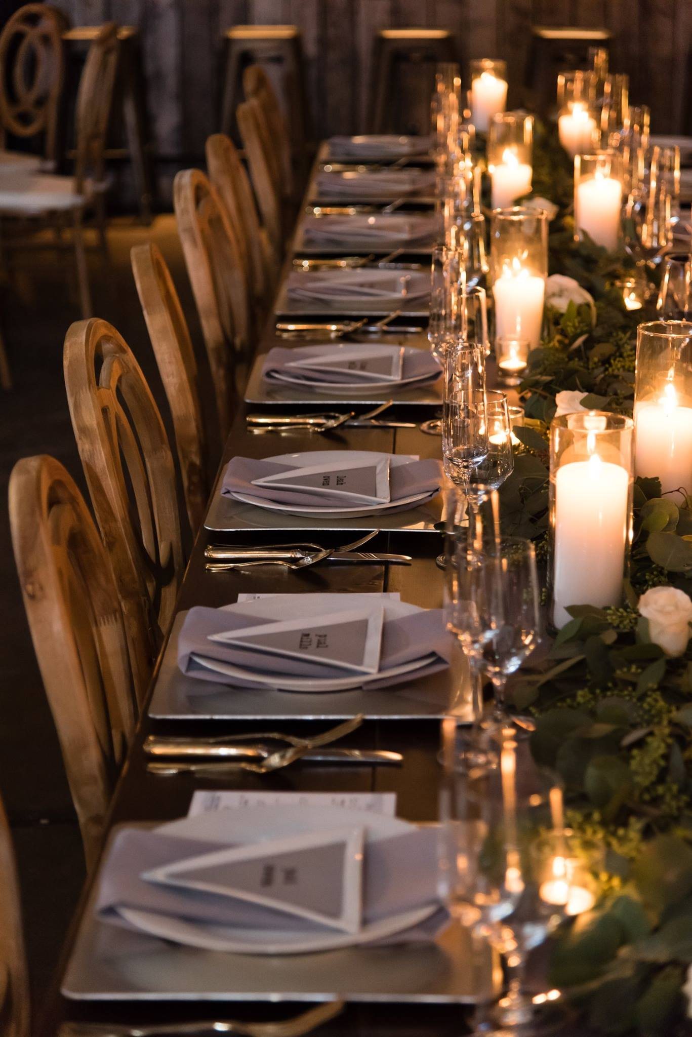 A candlelit event tablescape designed by Gather & Grace