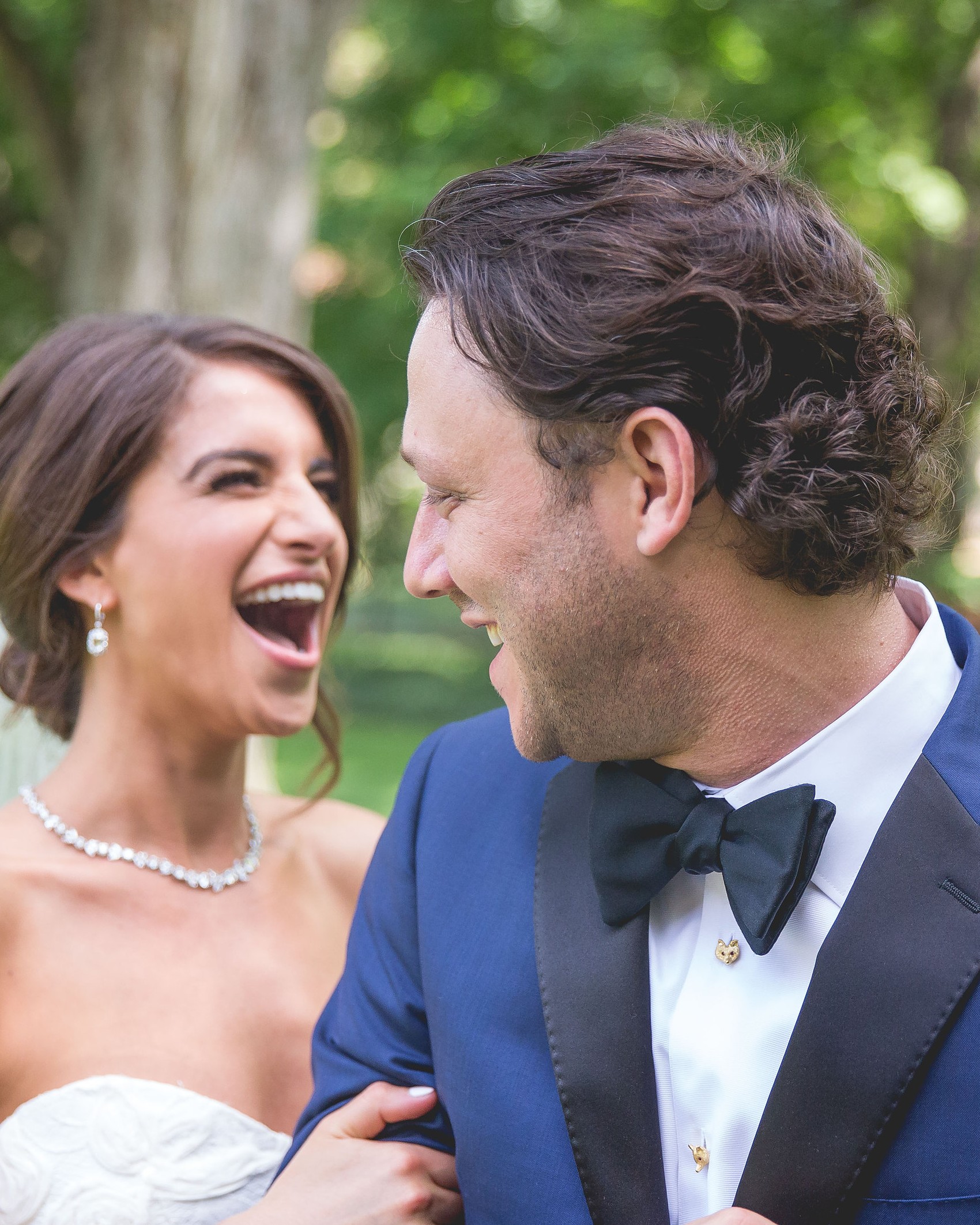 A bride and groom laughing together